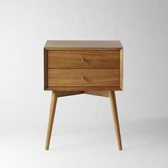 two white nightstands side by side with the words west elm nightstands on them