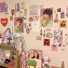 the wall is covered with pictures and magnets