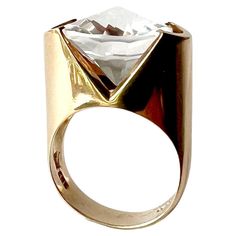 Crystal and 14K gold ring created by Hans Hansen of Denmark, circa 1960's. Faceted tension set crystal suspends mid air in its 14K gold setting. Ring stands about .75" above the finger. Signed HaH, Denmark, 585. Size 7.5 and in very good vintage 1960s condition. A great modern day alternative to an engagement or wedding ring. 11.3 grams. Modernist Jewelry Rings, Hans Hansen, Tension Setting, Ring Stand, Crystal Ring, 14k Gold Ring, Faceted Crystal, Crystal Rings, Cocktail Rings