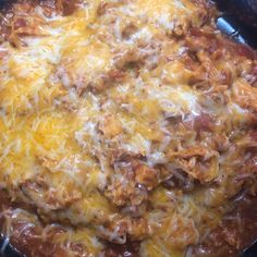 a casserole dish with cheese and meat in it