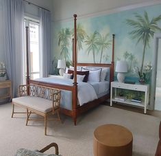 Relaxing bedroom with elegant tropical painted wallpaper of Palm Beach scenic. Rattan furniture and tall light blue curtains. Bedroom Mural, A Peaceful Place