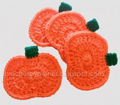 three crocheted pumpkins sitting on top of each other