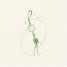 a drawing of a green ribbon and shamrocks on a white paper with the letter c