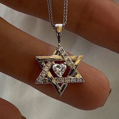 14K solid gold Star of David (Star of David) necklace set with a laboratory diamond heart 0.2CT (0.35CT total) Jewish star jewelry - handmade Israeli Judaica gift. Magen David length - 15 mm. The length of the chain - 42 cm. Discover the beauty of our Judaica jewelry collection, where each piece is crafted with care and devotion in Israel. This timeless piece of Jewish jewelry is a testament to the tradition, culture, and deep connection to the Holy Land.  This stunning Israeli Jewelry made from a 14k gold pendant captures the essence of Israel's spirit and heritage, making it a meaningful gift for a Bar Mitzvah, a gift for Passover, a gift for Hanukkah, or as a symbol of your faith or love for Israel. Celebrate your faith and heritage with this exceptional piece of Judaica jewelry. Order Jewish Star Necklace, David Star, Star Of David Necklace, Judaica Jewelry, Jewish Star, Star Of David Pendant, Jewish Jewelry, Deep Connection, Star Jewelry