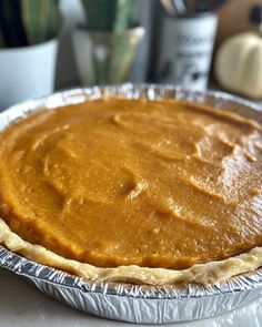 an uncooked pie sitting on top of a table