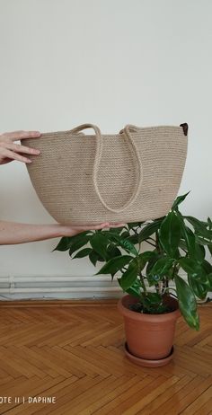 Meet the Jute Beach bag, the perfect carrying case for every beach adventure. This stylish and natural jute bag is ideal for stylish people who want to protect their belongings on beach trips. Made from 100% natural jute, this beach bag is both lightweight and tough enough to store your belongings safely. The bag has a tight-fitting drawstring, which means your belongings will stay safe while exploring the beach. Jute is naturally water resistant and protects your belongings from sand particles or any outdoor elements. The inside of this beach bag is spacious enough to hold all the supplies you might need to spend a day at the beach. Whether you're packing books, towels, sunscreen, snacks, or anything else, you can rest assured that Jute Back Beach has you covered. The bag also comes with Natural Bucket Canvas Bag For Travel, Natural Canvas Bag With Adjustable Strap For Daily Use, Natural Canvas Bucket Bag For Travel, Eco-friendly Canvas Bag With Adjustable Strap For Vacation, Casual Hemp Bags For Daily Use, Eco-friendly Natural Canvas Bag For Everyday Use, Eco-friendly Hemp Bag In Natural Color, Eco-friendly Hemp Bags In Natural Color, Natural Canvas Shoulder Bag For Daily Use