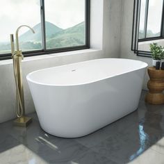 a large white bath tub sitting next to a window