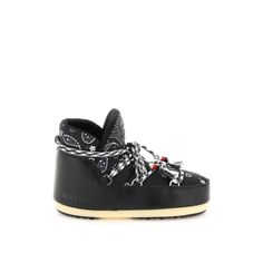 a pair of black sneakers with chains on the side and white soles, all tied up