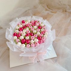 a bouquet of pink, white and green buttons