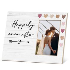 a wooden frame with hearts and the words happily ever after