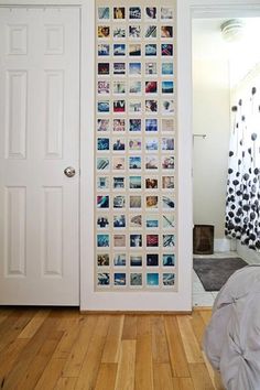 a door with pictures on it in front of a bed