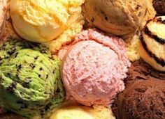 there are many different types of ice creams in this picture and one is pink, green, yellow, and chocolate