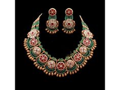 "Elegant gold-tone emerald green and ruby pink Kundan choker set with pearls, featuring intricate Jadau work. This stunning set includes matching Kundan earrings, perfect for weddings or festive occasions. green Kundan choker, Kundan pearl choker, Kundan Jadau choker, Kundan and pearl choker, Kundan Polki choker, pearl Kundan choker." Necklace and Earrings Necklace Has Been Adjustable Cord Hook Earrings Length Of Earrings - 1.5 Inches Gold Tone , Pearl , Jadau Kundan , Kemp Stone , Bead *SHOP LI Traditional Round Beaded Necklace For Formal Occasions, Traditional Round Beaded Necklaces For Formal Occasions, Traditional Beaded Necklace For Formal Occasions, Festive Hand-set Round Emerald Necklace, Festive Round Hand-set Emerald Necklace, Green Round Temple Jewelry Bridal Necklace, Gold Jeweled Beaded Necklace For Wedding, Traditional Emerald Necklace For Formal Festive Occasions, Festive Gold Jeweled Beaded Necklaces