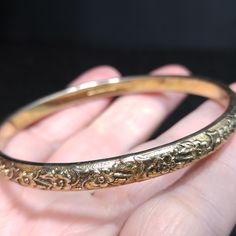 *Description: This is a great Whiting & Davis embossed gold tone floral bangle bracelet from the late 1960s to 1970s. The bracelet is in great condition and is signed on the inside of the bangle. This would be a great vintage bangle bracelet for your collection of Whiting & Davis and would also make a great gift. It would be the perfect bracelet to layer with other bangles. It is an over the hand bracelet, no clasp. *Approximate Measurements: Length - 7 1/2 Inches, Width - 1/4 Inch *Cond Rich Wishlist, Amp Davis, Bangle Bracelet Gold, Formal Earrings, Vintage Bangle Bracelets, Bangles Gold, Book Pieces, Late 1960s, Vintage Bangles