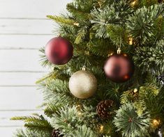 a christmas tree with ornaments hanging from it