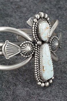 This stunning Dry Creek turquoise and sterling silver bracelet was made by Navajo silversmith Michael Calladitto. The inside is signed MC and stamped sterling.Size: 5 1/2" (will fit up to a 6 3/4" wrist)Gap: 1 1/4"Width: 2 1/8"Free shipping on all orders! We ship with USPS and always include tracking. All orders ship within a day of payment.Returns are accepted up to 30 days after you receive your order. Just send us a message. Our shop offers cash back or store credit. The item must be returned Western Silver Bracelet With Patina, Southwestern Silver Jewelry With Patina, Collectible Southwestern Style Silver Turquoise Ring, Southwestern Silver Cuff Bracelet, Silver Western Cuff Bracelet With Patina, Southwestern Untreated Bracelet Jewelry, Elegant Turquoise Concho Jewelry, Elegant Silver Bracelets With Patina, Elegant Silver Patina Bracelets