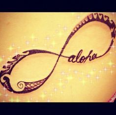 the word aloha is written in black ink on a woman's stomach