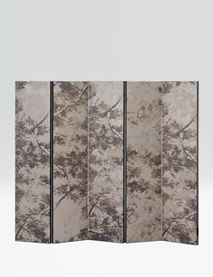 four panel screen with trees on it in grey and beige tones, set against a white background