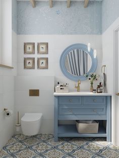 a bathroom with a blue vanity and white toilet