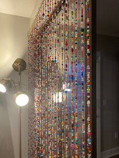 there is a very large amount of beads hanging on the wall