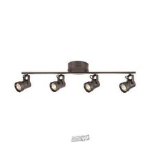 three spotlights are on the ceiling in an industrial style lighting fixture with four lights