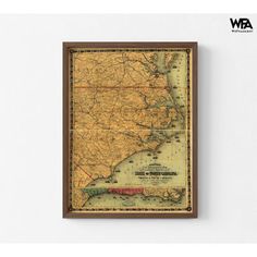 an old map of the united states in brown frame on a wall with white background