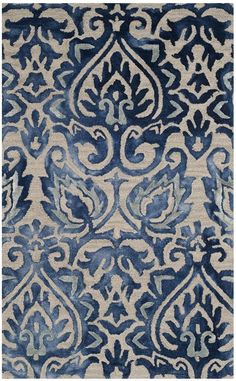 a blue and white rug with an ornate design on the bottom, it is very soft