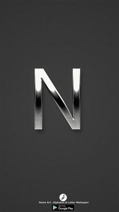 the letter n made out of metal on a black background with white lettering and silver accents