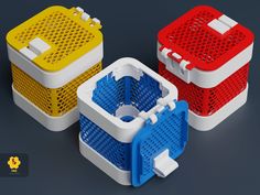 three plastic containers with holes in them on a gray background, one is red, one is blue and the other is yellow