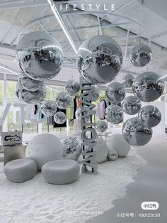 an advertisement for a clothing store with disco balls hanging from the ceiling and on display