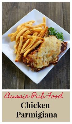 chicken parmesan and french fries on a white plate with the words aussie pub food