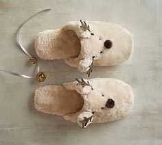 a pair of slippers that have been made to look like a teddy bear