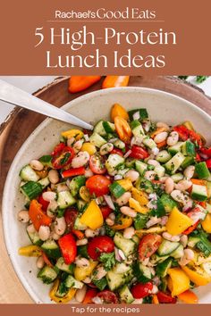 a white bowl filled with vegetables on top of a wooden table