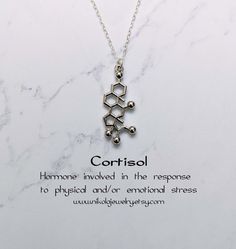 Cortisol Molecule Necklace. Cortisol is a steroid hormone that regulates a wide range of processes throughout the body, including metabolism and the immune response. Pendant size: 1 x 0.6 inch. Purchase includes a natural jewelry box and gift packaging. Gift? Add-on a hummingbird card for only $7: https://www.etsy.com/listing/202506976/nikola-jewelry-hummingbird-card Add-on extender: https://www.etsy.com/listing/197483038/add-on-necklace-extender-chain-with Necklace longer than 20 inches: https: Cortisol Molecule, Hummingbird Card, Molecule Jewelry, Doctor Jewelry, Chemistry Jewelry, Molecule Necklace, Science Jewelry, Medical Jewelry, Geek Jewelry