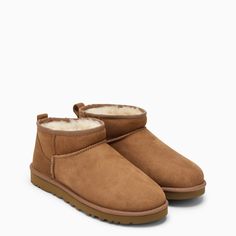 Chestnut-coloured suede low boot by UGG, featuring regenerated wool lining, reversed sheepskin upper, round toe and Treadlite sole by UGG.Upper: 100% Shearling / Lining: 80% Regenerated wool - 20% Lyocell / Embroidery: 100% Polyester / Rubber sole Ugs Low, Low Rise Uggs, Ugh Ultra Mini, Low Ugg Boots, Uggs Classic Ultra Mini, Ugg Boots Aesthetic, Uggs Low, Ankle Uggs, Uggs Mini Boots