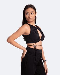 We dare you to blend into the crowd with the Sexy Front-Tie Support Top. Jokes! There’s no blending in with this top, but we’ve got a feeling blending in will be your last priority. Stand out and look good while doing it with this statement piece in your lineup. Edgy Crop Top With Built-in Bra For Night Out, Edgy Party Tops With Built-in Bra, Edgy Tops With Built-in Bra For Night Out, Trendy Evening Tops With Built-in Bra, Flirty Tops For Club, Flirty Black Tops For Club, Flirty Black Top For Club, Top Jokes, Dance Leggings