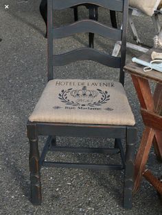 two chairs sitting next to each other in front of a storefront window with signs on them