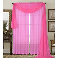 pink sheer curtains hanging in front of a window