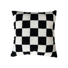 a black and white checkered pillow on a white background