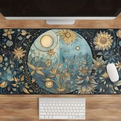 a computer keyboard sitting on top of a wooden desk next to a mouse and monitor