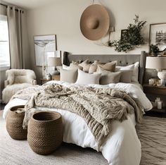 a large bed with blankets and pillows in a bedroom