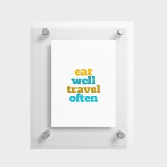 an art print with the words eat well travel often on it in blue and yellow