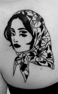 a woman with a scarf on her head is shown in black and white tattoo art