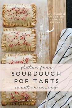 some food that is on top of a wooden board with the words buttery sourdough pop tarts next to it