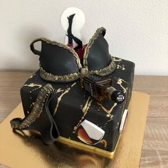 a cake made to look like an old fashioned teapot with spoons in it