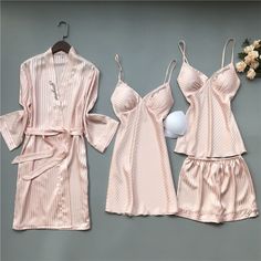 Sleep like royalty in our 4 Piece Nightwear Solid Color Stripes Set. This collection features a comfortable nightshirt, coordinating shorts, and a soft robe. Unwind in style and comfort, and experience the perfect blend of fashion and relaxation. Pamper yourself with the utmost comfort and sophistication. Specifications: Each of the sleepwear is sourced from the finest quality fabric, sewn together by quality workmanship. Made with cotton, lycra, and dacron material Unshrinkable, wrinkle-resista Elegant Red Sleepwear For Loungewear, Pink Summer Night Robe, Elegant Sleepwear For Pajama Party, Elegant Pink Sleepwear For Loungewear, Elegant Summer Lounging Sets, Elegant Sleepwear For Sleepovers, Elegant Summer Sleepwear For Sleepovers, Feminine Sets For Home, Elegant Summer Sleepwear