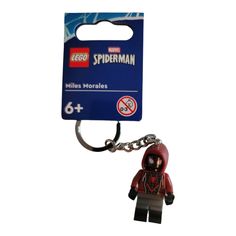 a lego keychain with a spiderman figure on it's front and back