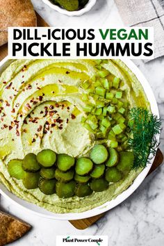 Overhead view of a plate of swirled green hummus topped with red pepper and sliced pickles with text reading delicious vegan pickle hummus Pickle Hummus Recipe, Dill Pickle Hummus, Pickle Hummus, Hummus Recipes, Easy Hummus Recipe, Vegan Dip, Dill Pickles, Vegan Hummus