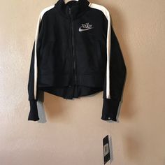 Cotton & Polyester. Nike Long Sleeve Track Jacket For Winter, Nike Winter Track Jacket With Long Sleeves, Nike Winter Track Jacket Long Sleeve, Nike Winter Long Sleeve Track Jacket, Nike Long Sleeve Winter Track Jacket, Nike Long Sleeve Cotton Outerwear, Nike Cotton Track Jacket For Fall, Nike Trendy Long Sleeve Outerwear, Nike Cotton Long Sleeve Track Jacket