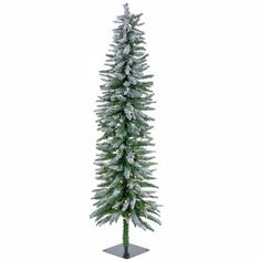 a tall white christmas tree with snow on it's top and branches in the bottom